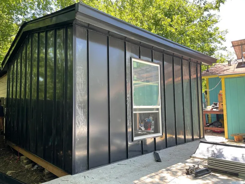 Black standing seam metal wall panels for Roof Inspection in Nederland