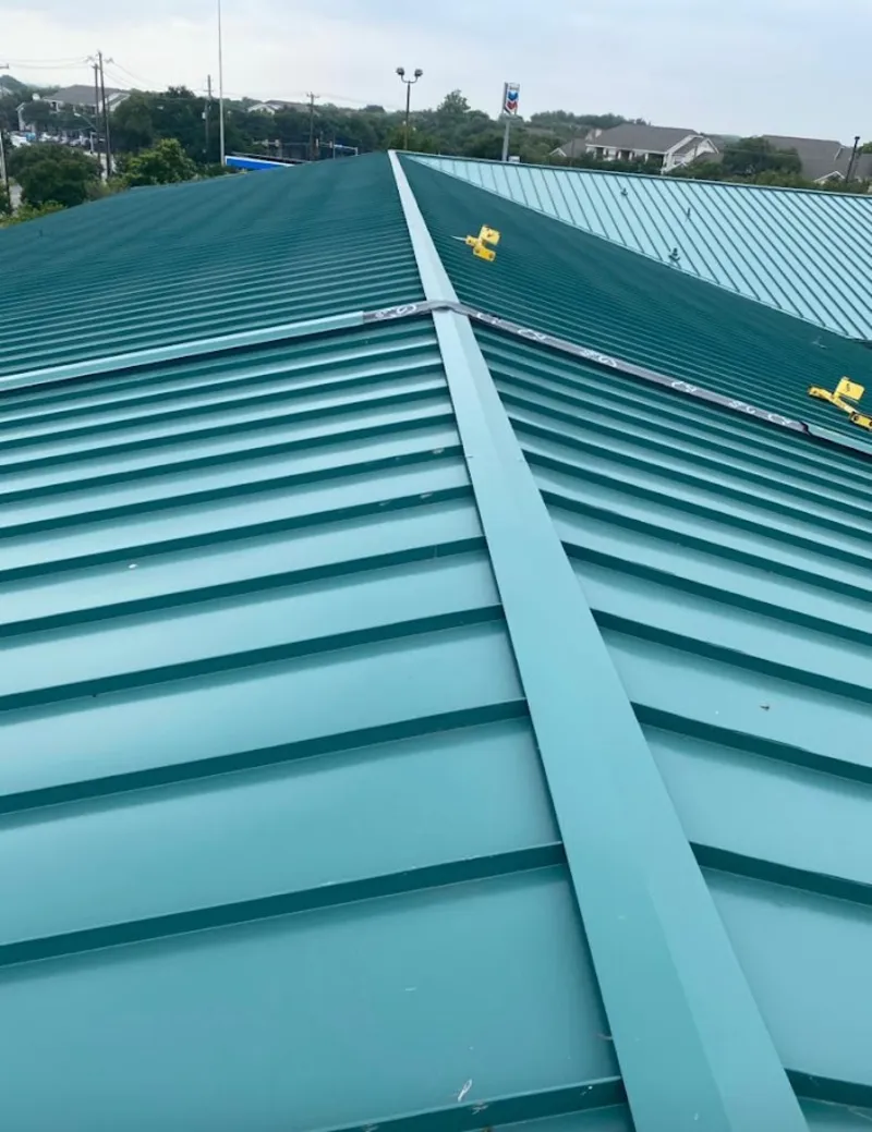 Green commercial metal roof ridge and valley for Metal Roof Repair in Nederland