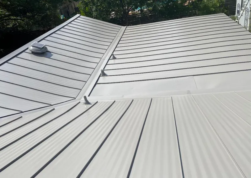 Solar attic fan installed on a metal roof for Roof Ventilation in Nederland